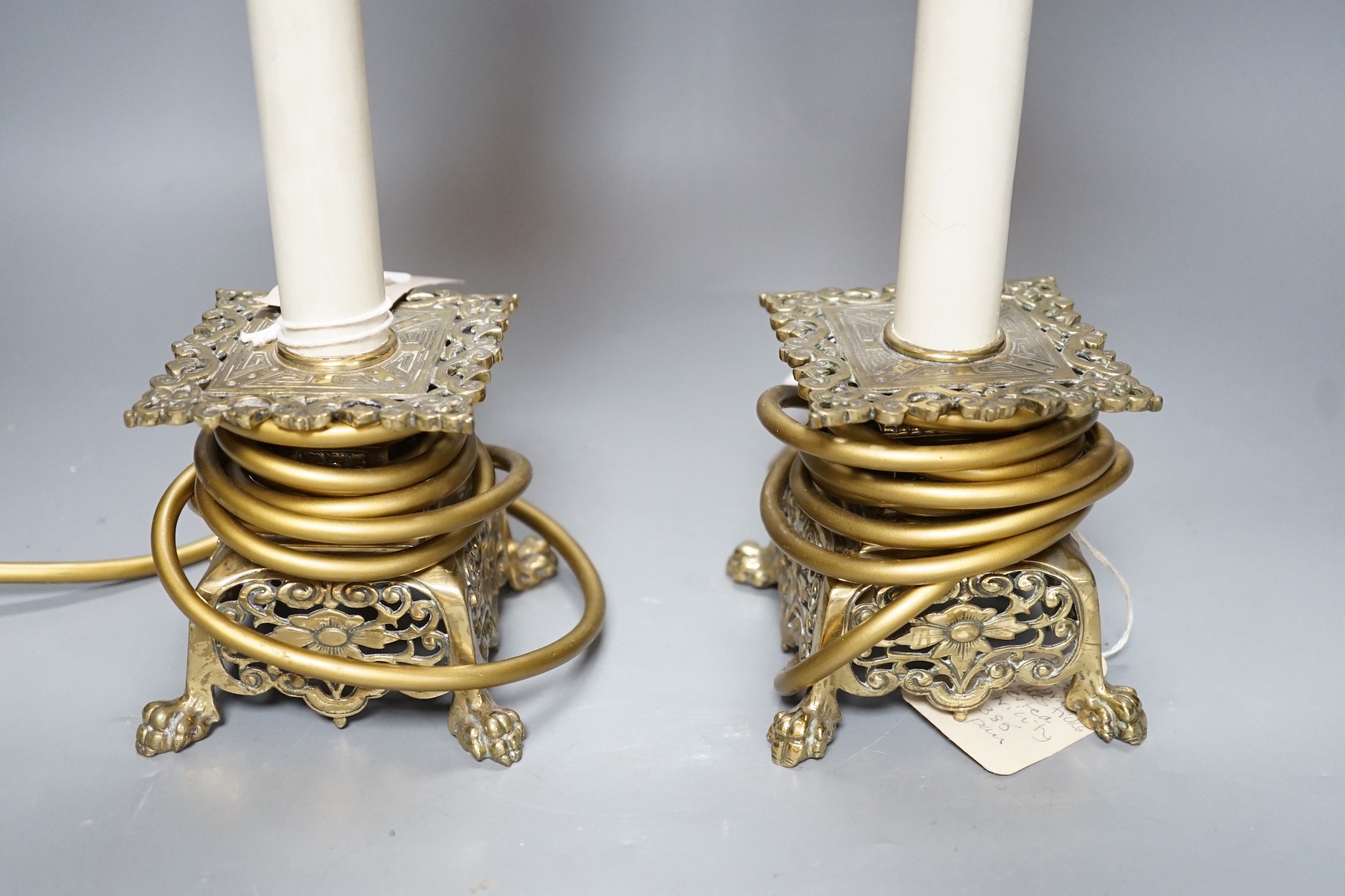 A pair of late 19th century converted brass lamps